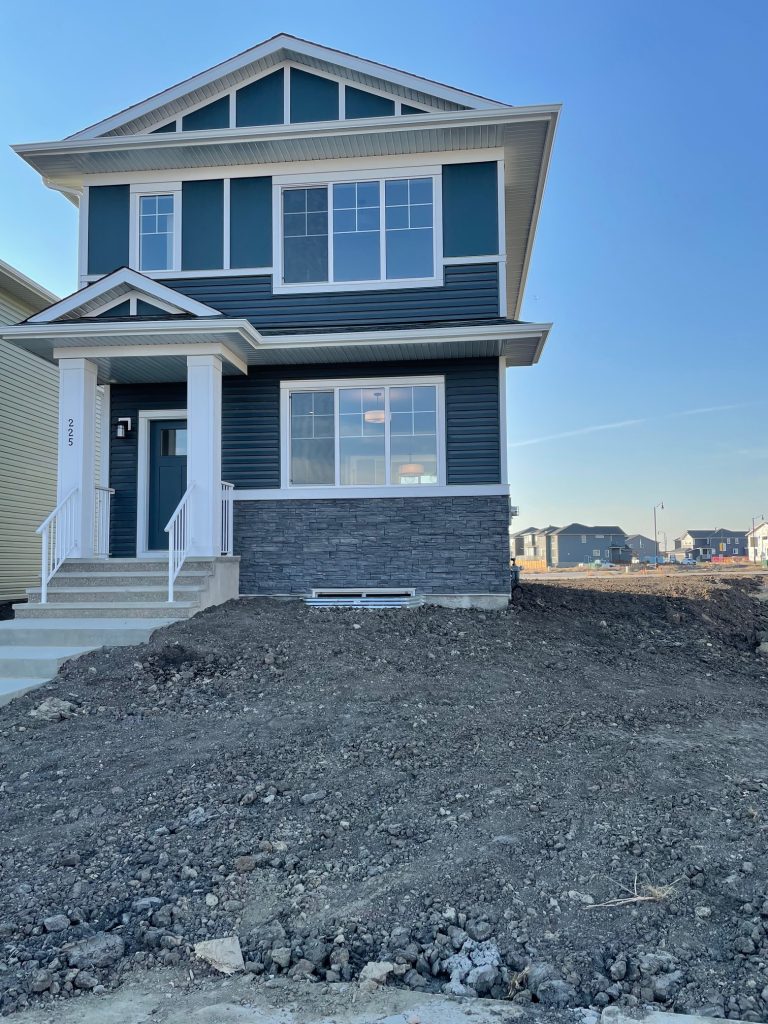 Front of the home on closing day, in Chestermere Alberta